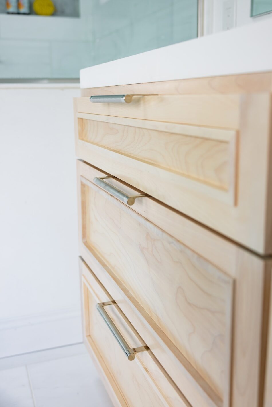 bathroom-vanity-detail-natural-wood-drawers