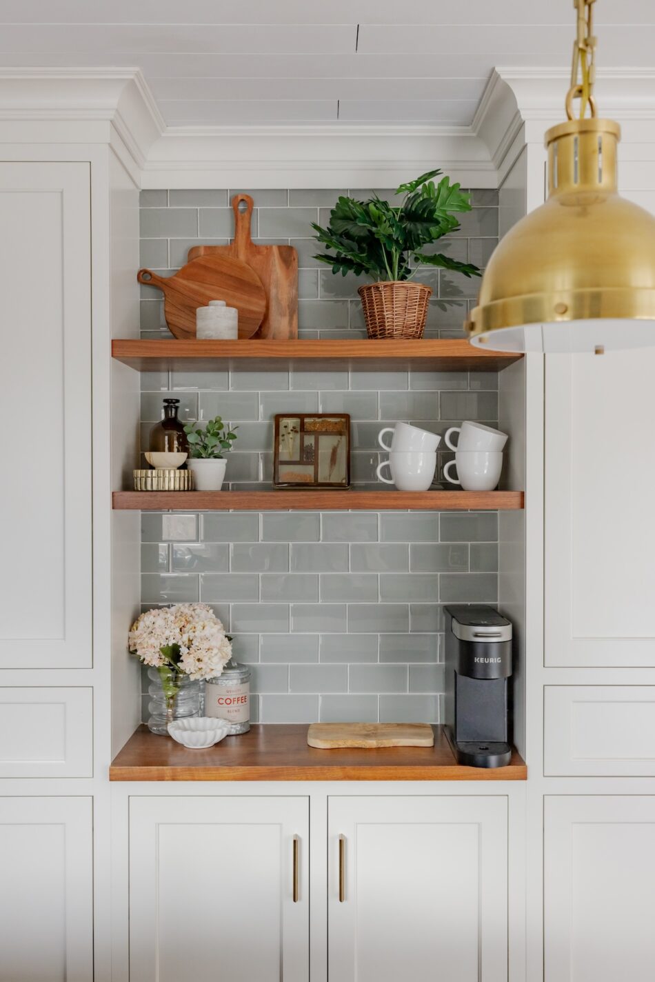 kitchen-floating-shelves-light-blue-sage-green-subway-tile-backsplash