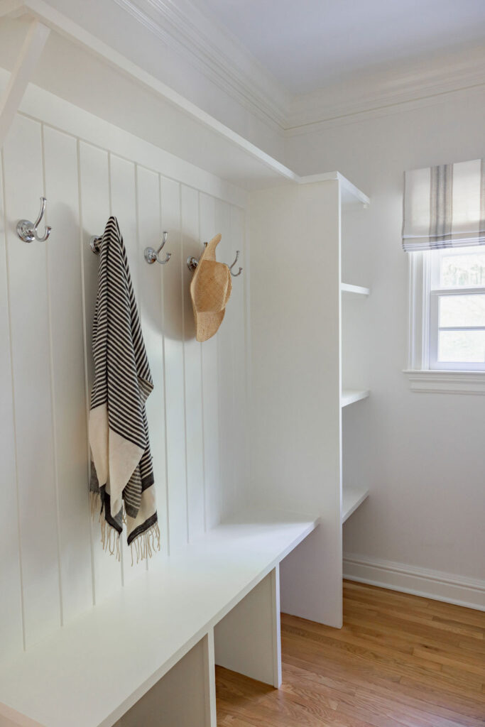 White cabinets and storage mudroom in a Ridgefield CT home. 