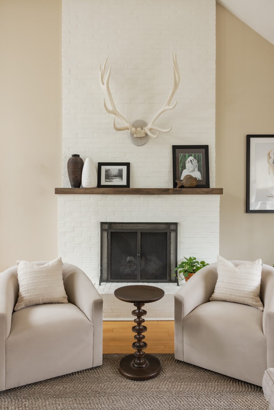 living-room-brick-fireplace-white-with-antlers-over-mantel